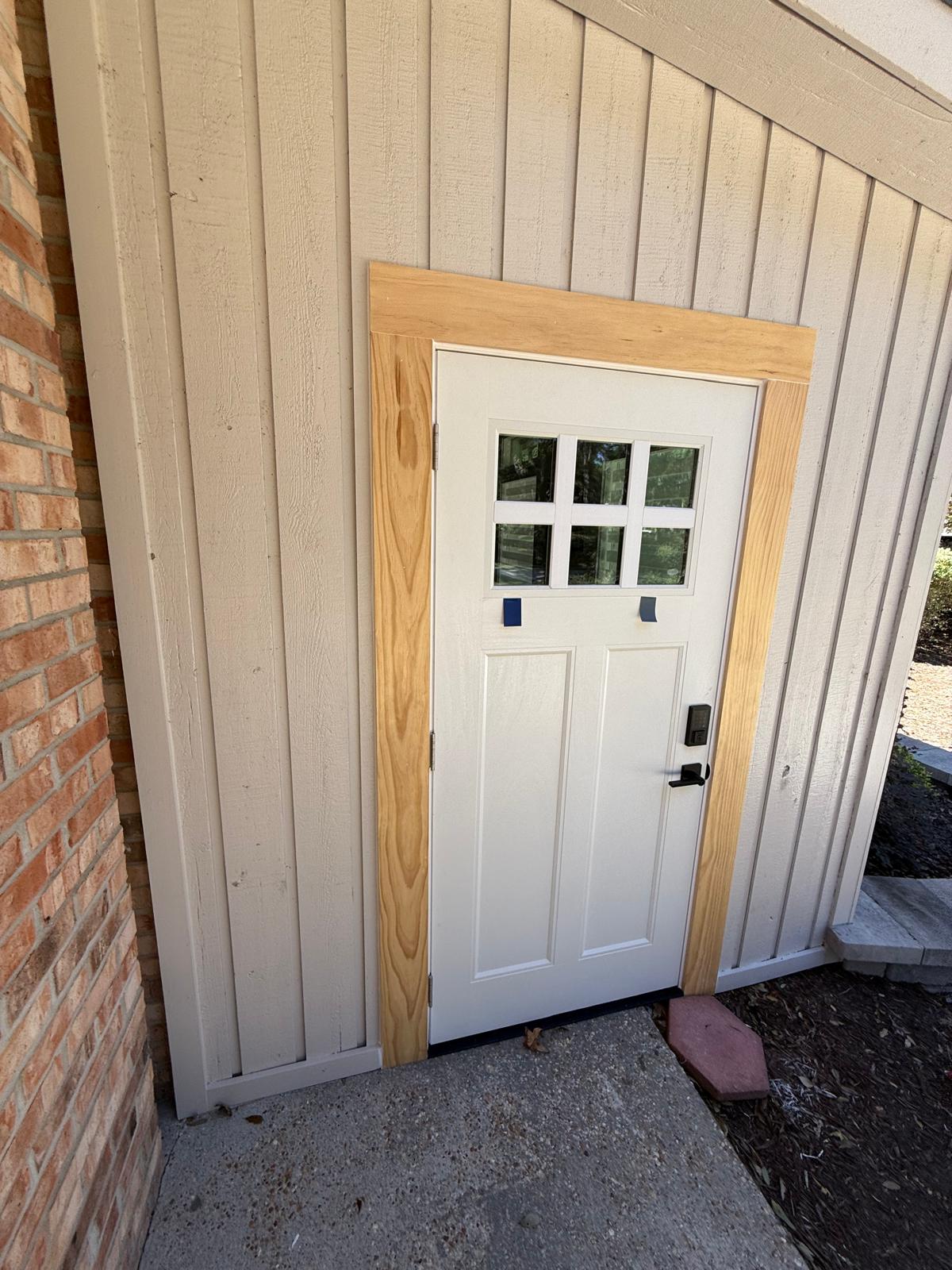 Craftsman door with natural wood frame