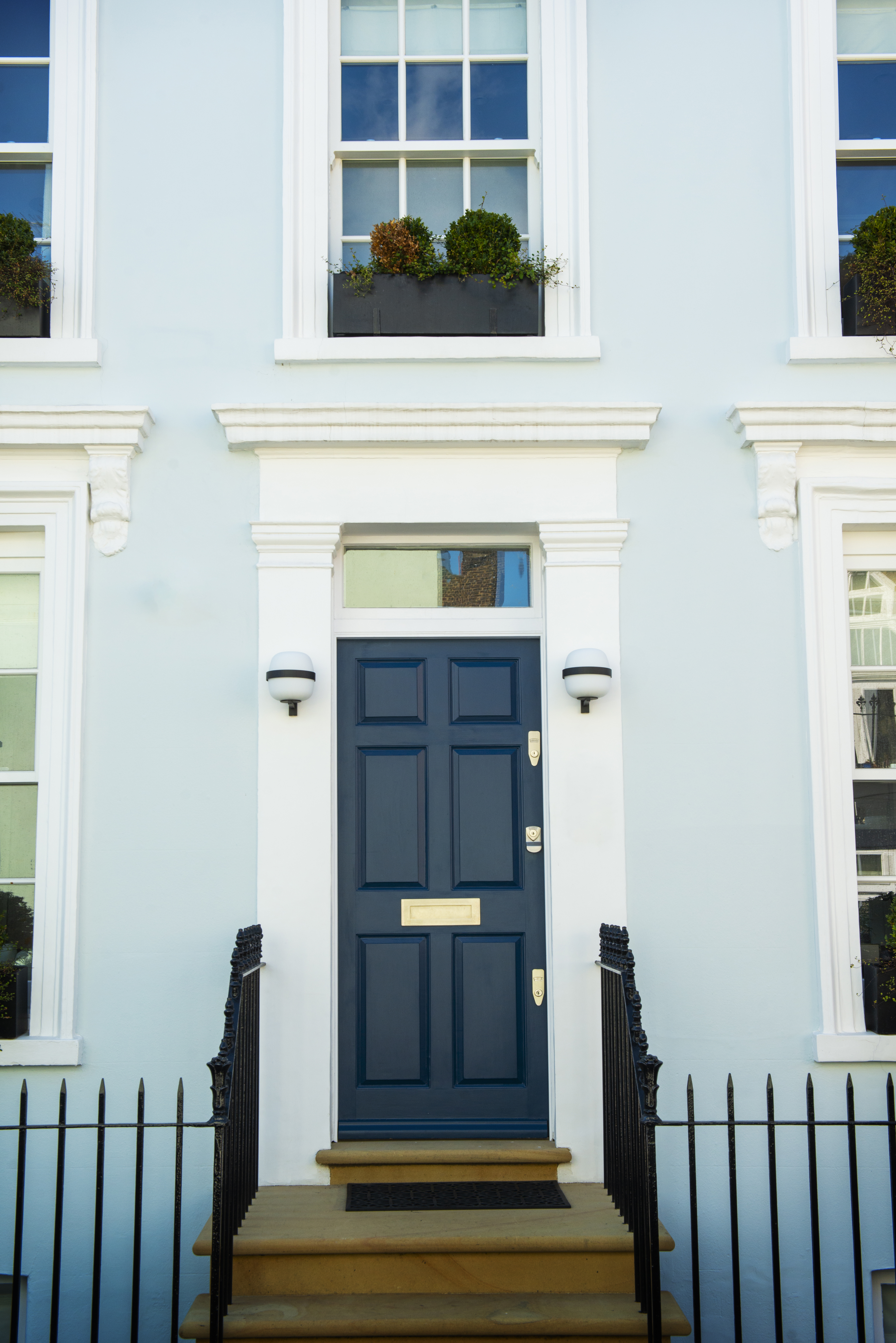 Front door with blue façade
